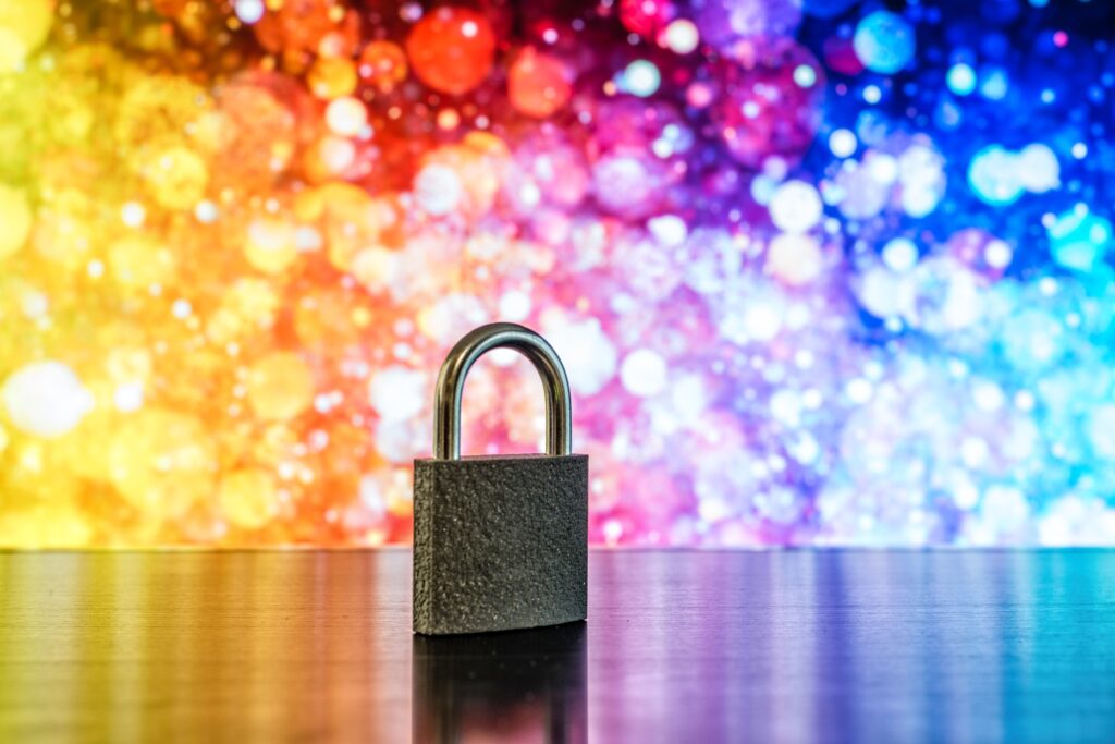 padlock on a table with a multicoloured background