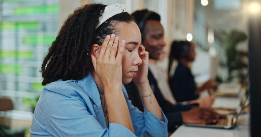 Call center, woman and consultant with headache of stress for lead generation, exhausted and overwo.