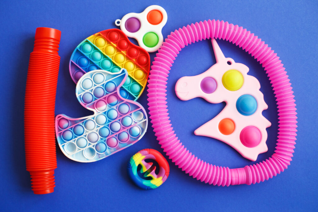 colorful antistress sensory fidget toys on a blue background