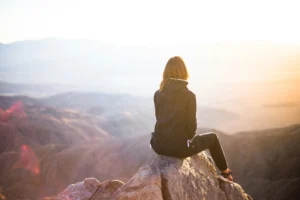 Woman looking into a nice skyline and mountain range